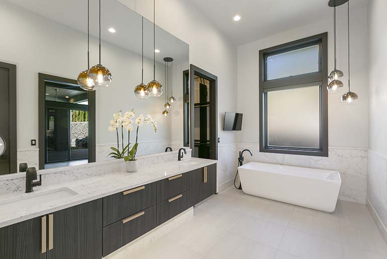 A beautifully remodeled bathroom featuring high-quality cabinets and countertops, showcasing the success of a remodel project.